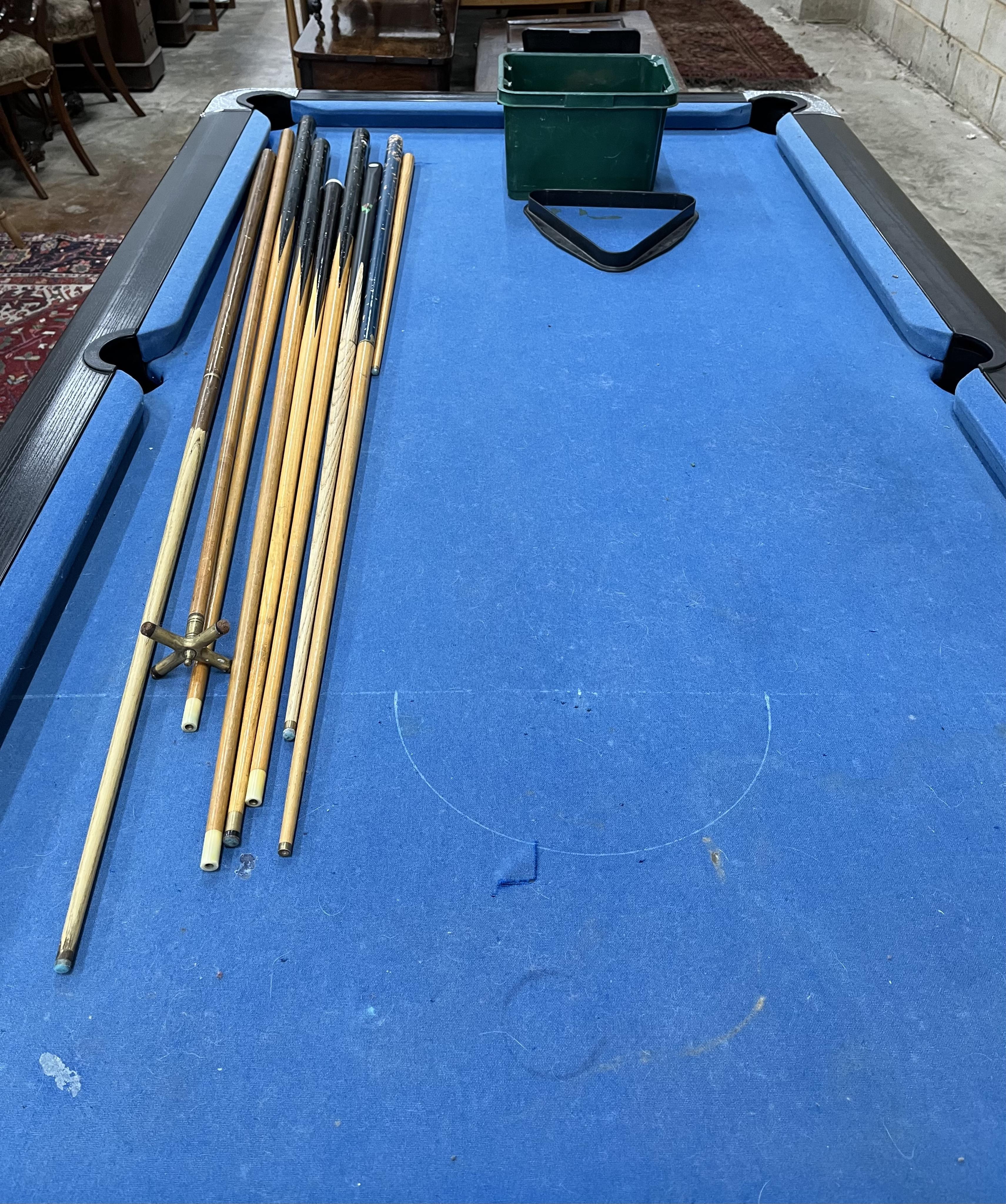 A Supreme pool table with all accessories, width 210cm, depth 120cm, height 82cm. Condition - fair, baize poor